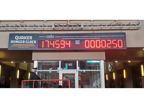 15 inch LED network IP controlled number display representing countdown to super bowl 57 in minutes and the number of packets of food donated